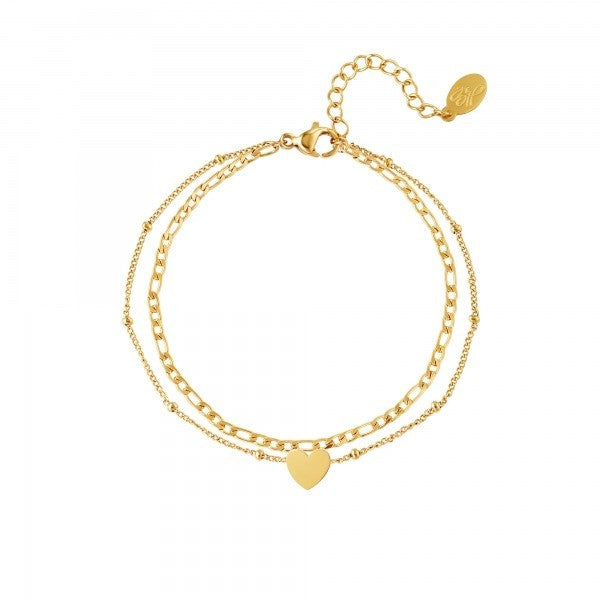 Roestvrijstalen meerlaagse armband met hartjeshanger Kleur: Goud Materiaal: Stainless Steel / Nickel Free Afmeting: ca. 16cm + 3cm Merk: Yehwang Kleur foto kan iets afwijken van origineel